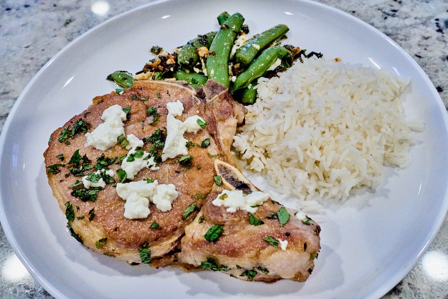 Kane’s Cuisine: Pork chops with feta, snap peas, & mint