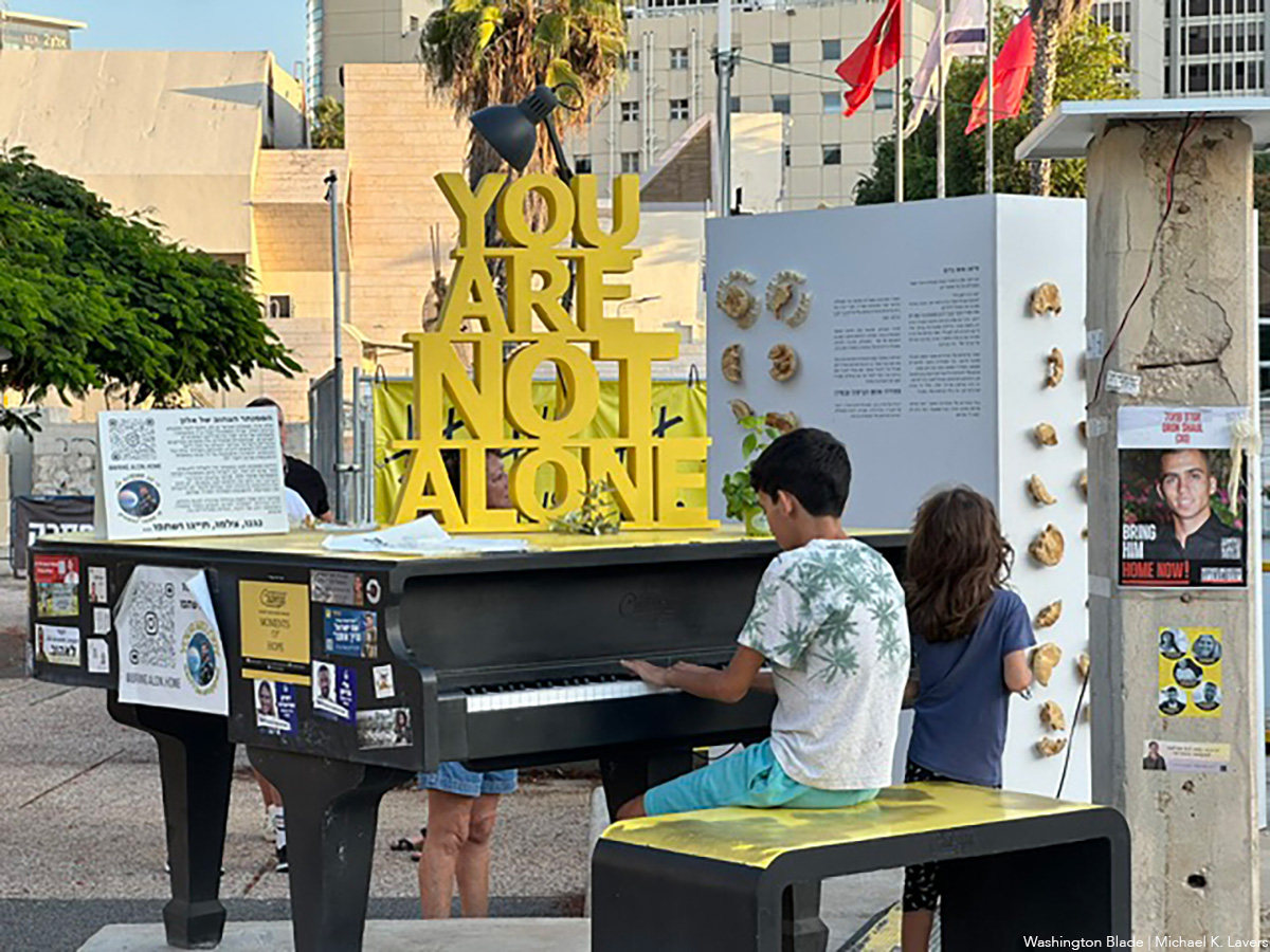 20241004_boy_playing_piano_in_Hostage_Square_in_Tel_Aviv_Israel_insert_(c)_Washington_Blade_by_Michael_K_Lavers
