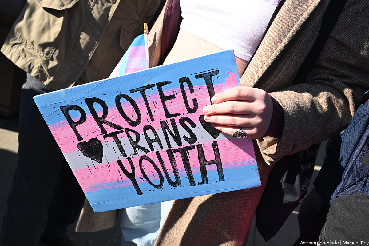 20260113_Protect_Trans_Youth_sign_outside_US_Supreme_Court_building_following_oral_arguments_insert_(c)_Washington_Blade_by_Michael_Key