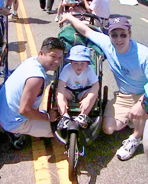 Ronald Gamboa, Dan Brandhorst and adopted son David, part of the West Hollywood Pop Luck Club contingent at CSW/LA Pride (photo by Karen Ocamb)